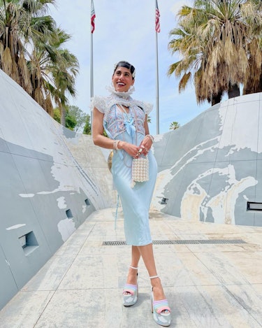 Thalia Castro-Vega in light blue outfit and rainbow cloud heels