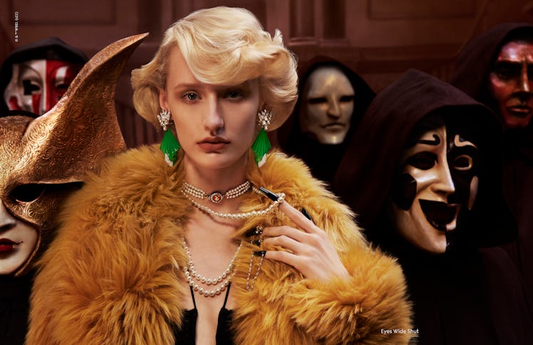 A model wearing a furry yellow coat in a Gucci campaign inspired by 'Eyes Wide Shut'