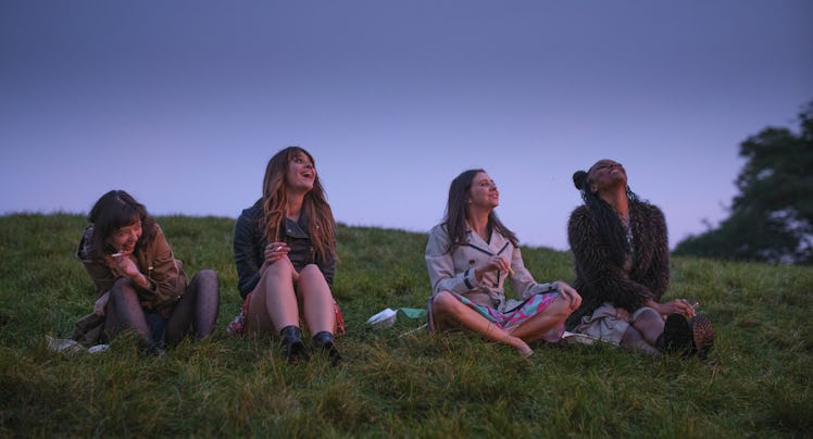 'Everything I Know About Love' cast sitting on grass.