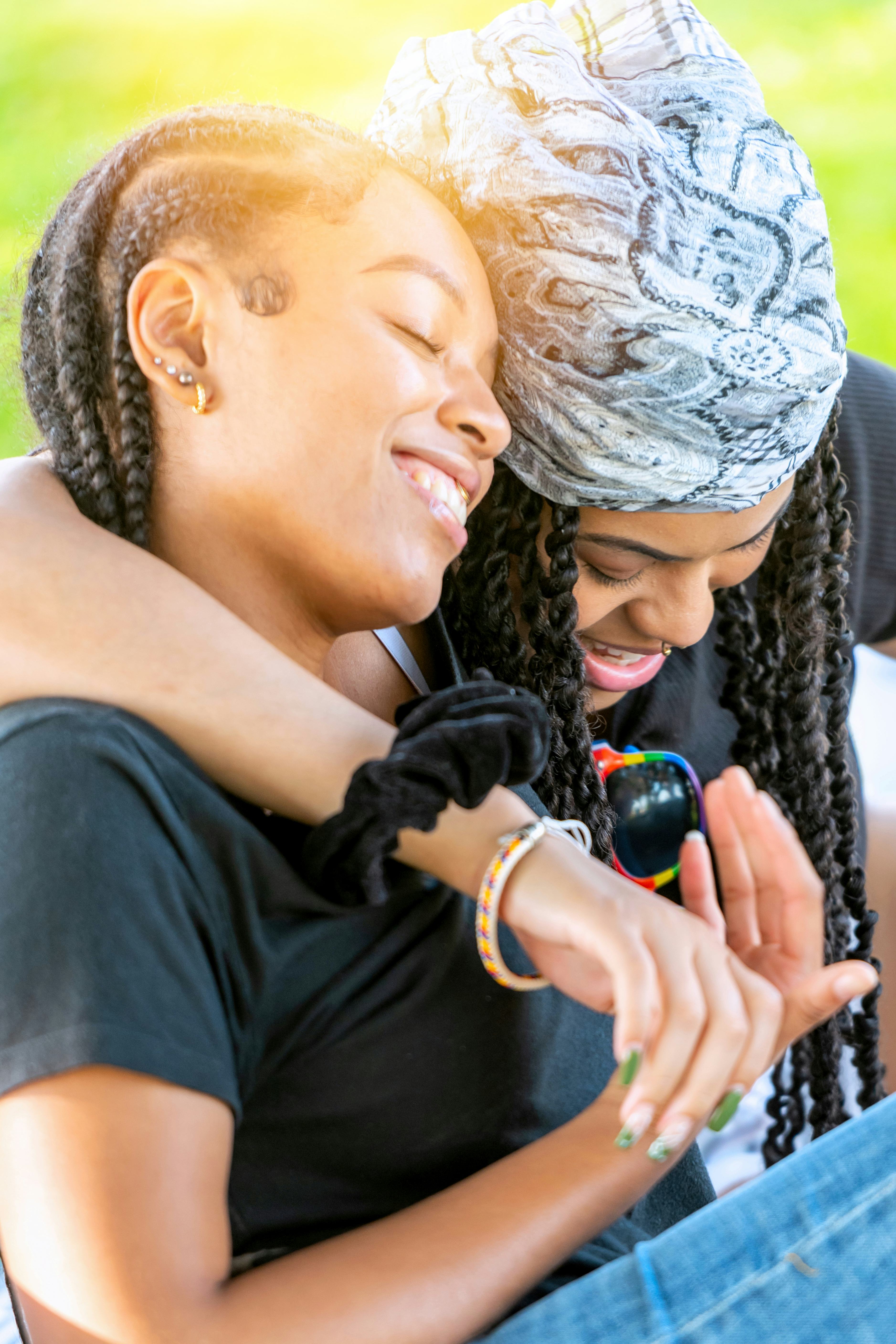 Young couple with their arms around each other on the most romantic day in September 2022 for every ...