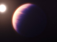 large jupiter-like planet glowing from light of a nearby star