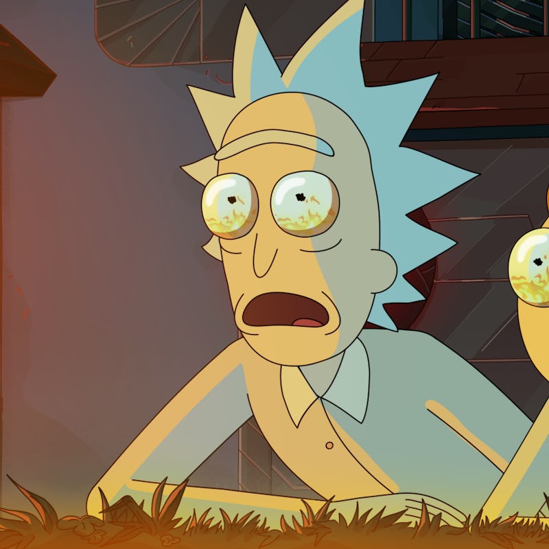 Rick and Morty staring at a giant fire.