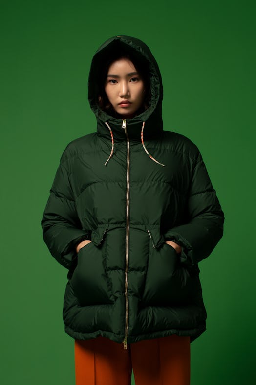 A model in a Herno Global forest green jacket