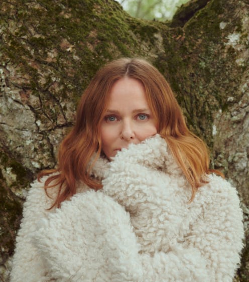 Fashion designer Stella McCartney by a tree