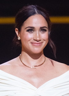 Meghan Markle looking off into the distance and smiling
