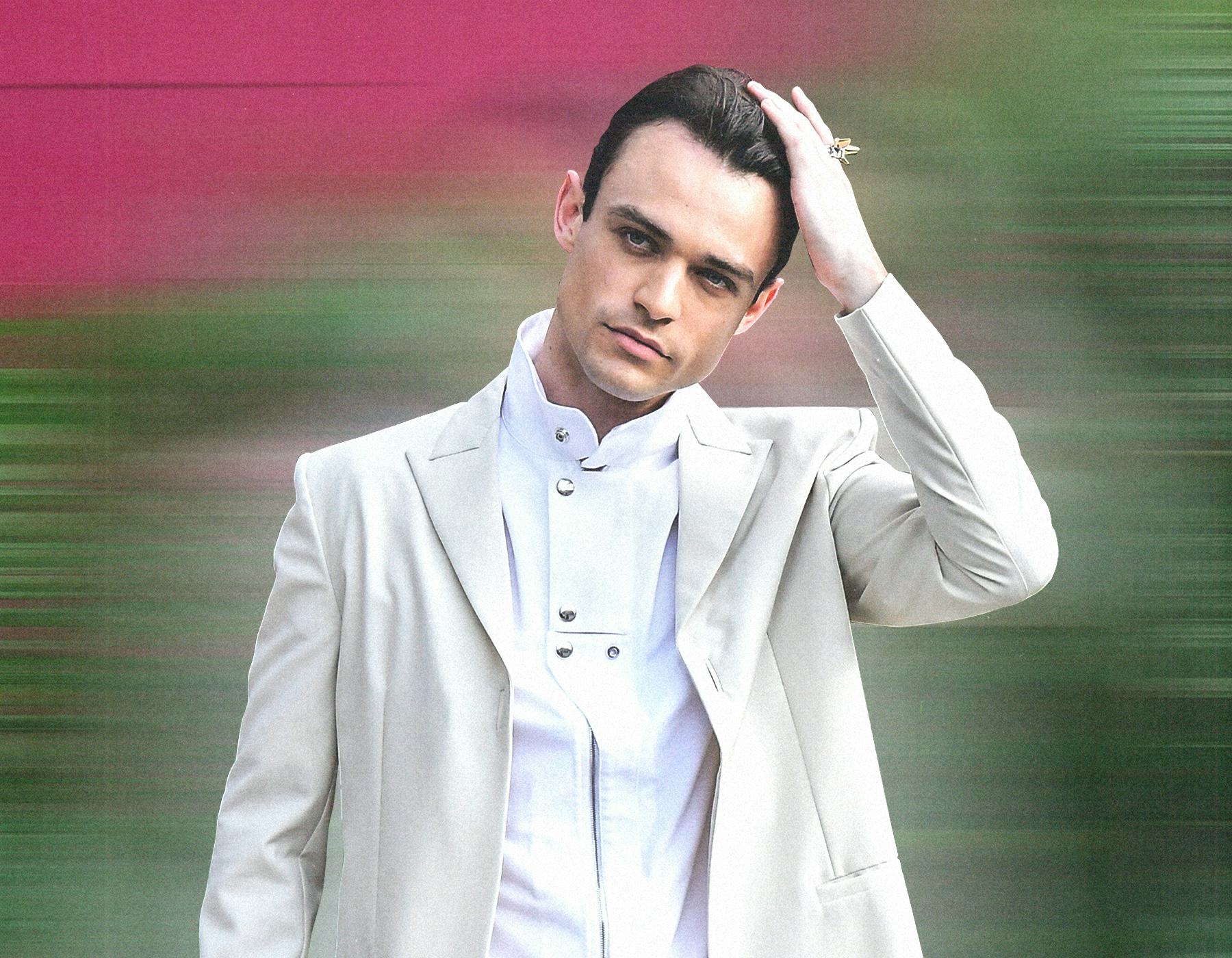 A photo of Thomas Doherty in a white tuxedo