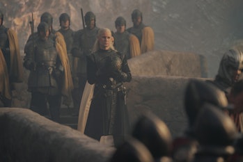 Daemon Targaryen (Matt Smith) stands across from Otto Hightower (Rhys Ifans) in House of the Dragon ...