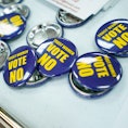 Badges for the Vote No on the Constitutional Amendment on Abortion are laid out for canvassers at th...