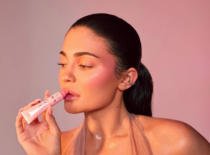 Kylie Jenner wearing Kylie Cosmetics' Gloss Drip & Glow Balm, one of the Kylie Cosmetics names that ...