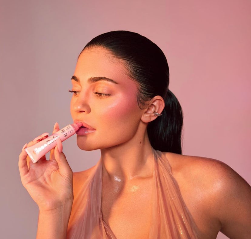 Kylie Jenner wearing Kylie Cosmetics' Gloss Drip & Glow Balm, one of the Kylie Cosmetics names that ...