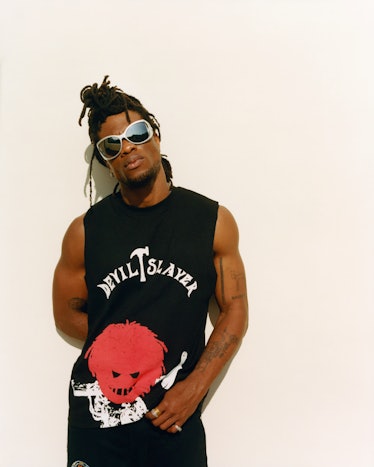 Obongjayar photographed in Los Angeles wearing a black tank top that says devil slayer