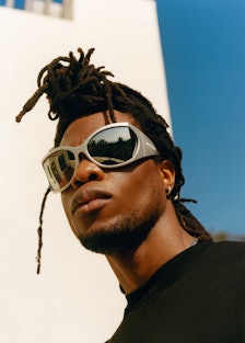 Obongjayar wearing futuristic sunglasses
