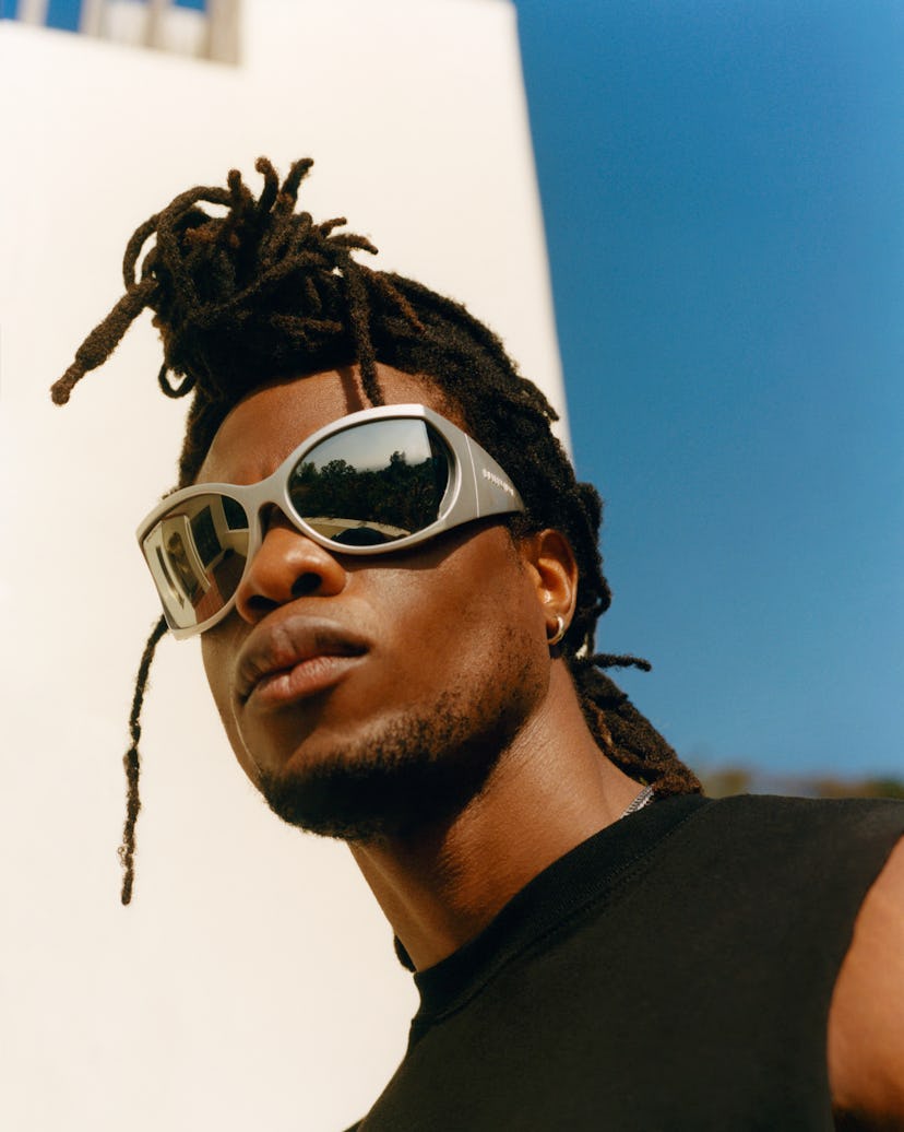 Obongjayar wearing futuristic sunglasses