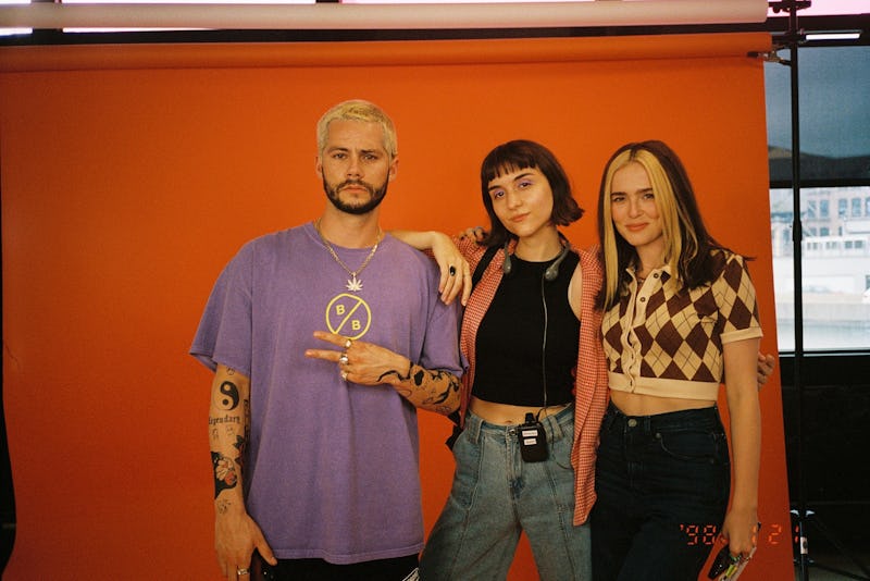 Dylan O'Brien, Quinn Shephard, and Zoey Deutch, pose on set of the 'Not Okay' movie.