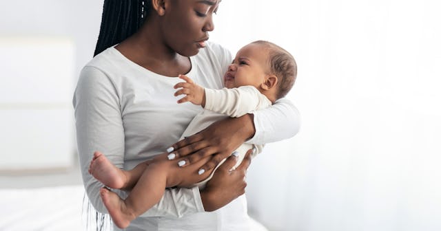 Woman holding her baby with RSV