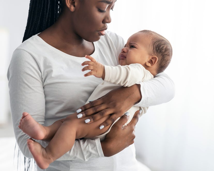 Woman holding her baby with RSV