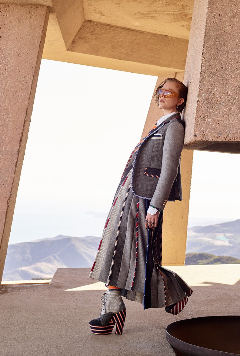 Hannah Einbinder in Thom Browne clothing, tie, socks, and shoes, Jennifer Fisher earrings, Burberry &hellip;