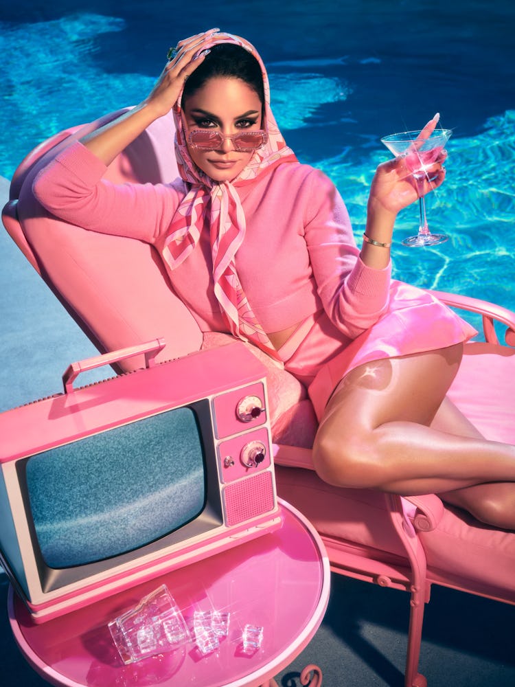 Vanessa Hudgens posing by the pool in all-pink outfit
