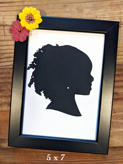 Hand-cute silhouette black portrait on white paper in a black frame, perfect for a customizable gran...