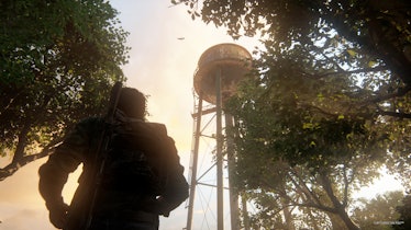 Joel looks up at a water tower in The Last of Us Part I.