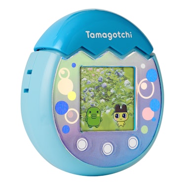 A blue Tamagotchi Pix showing the camera feature in action, with two Tamagotchi characters standing ...