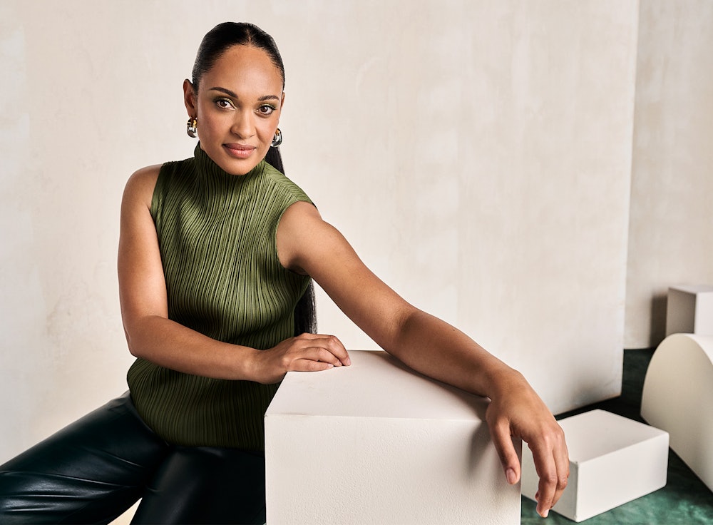 Actress from The Rings of Power Cynthia Addai-Robinson in Issey Miyake top, Aknvas pants, and Lizzie...