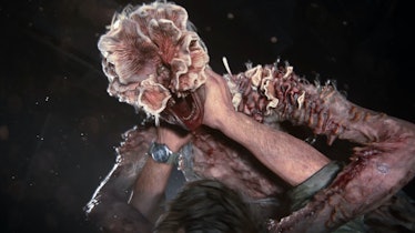 Joel fends off a clicker, with fungal growth covering its human face.
