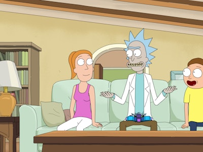 Rick Sanchez sitting next to Morty and Summer on a couch 