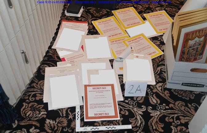 Top secret documentation all over the floor as evidence from the FBI raid on Donald Trump