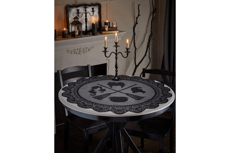 This tablecloth is part of the Spirit Halloween 'Hocus Pocus' 2022 decorations collection. 