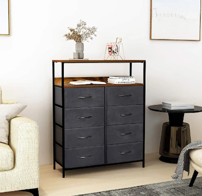 The Kamiler dresser for small spaces has two shelves on top for extra storage.