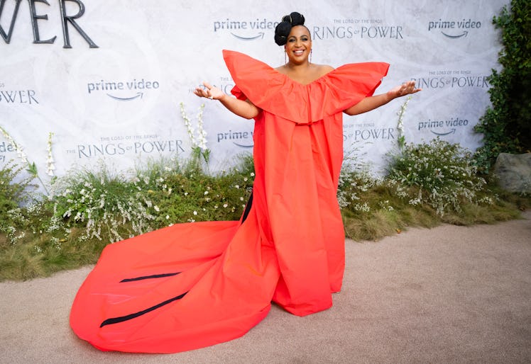 Sophia Nomvete wearing a large red dress with exaggerated shoulders at the world premiere of The Lor...