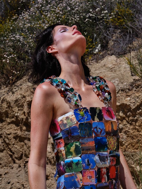 Young lady posing in a colorful Thousand Screen Television dress