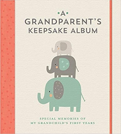 This beige keepsake album with orange binding and three stacked elephants with patterns is a great g...