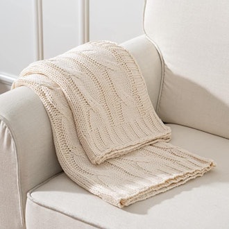 This classic cable chunky knit blanket comes in 11 colors.