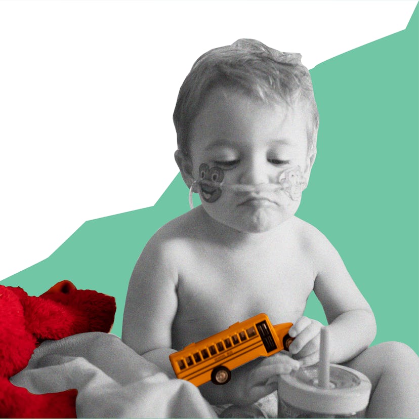 Baby with rsv playing with a toy school bus