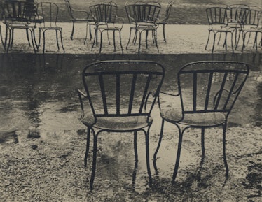 A black-and-white photo of empty chairs