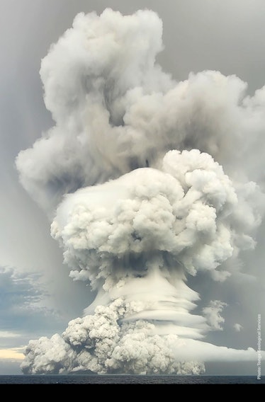 The Hunga Tonga Hunga Ha'apai eruption. A gigantic plume of ash and smoke shoots straight up into th...
