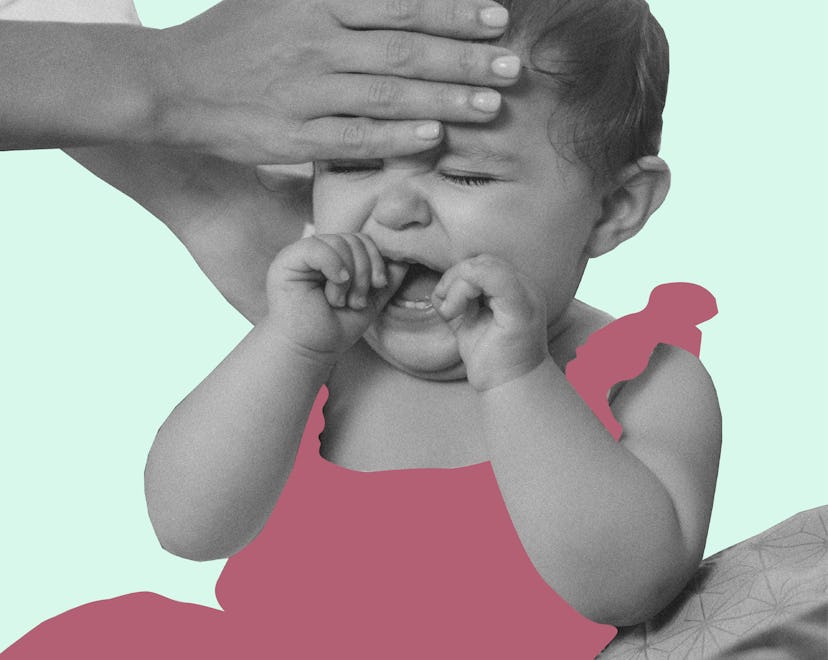 Mom checking her daughters temperature to see if she has RSV