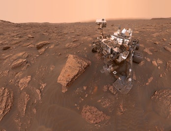 curiosity rover against the backdrop of Mars