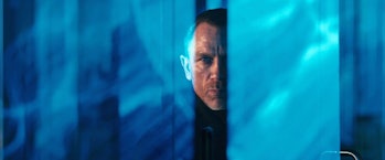 Daniel Craig looks through a glass wall in Skyfall