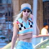 Gigi Hadid wearing a brown hat and cropped sweater vest