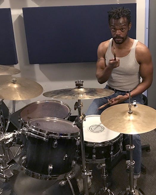 William Jackson Harper sitting behind a drum kit