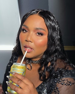Lizzo long hair sipping le croix
