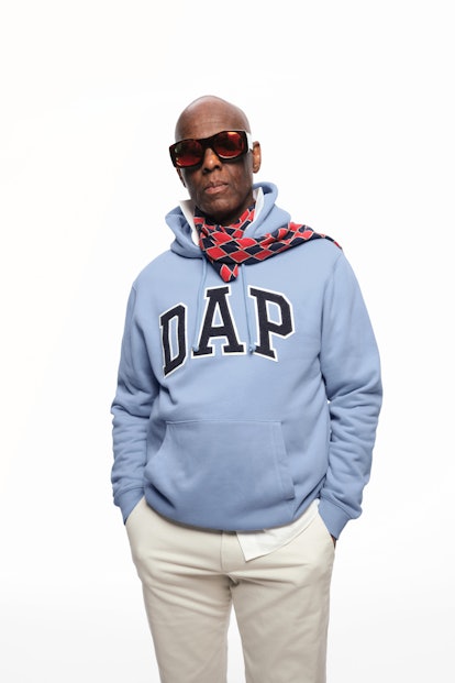 Dapper Dan posing in a light blue "DAP" hoodie