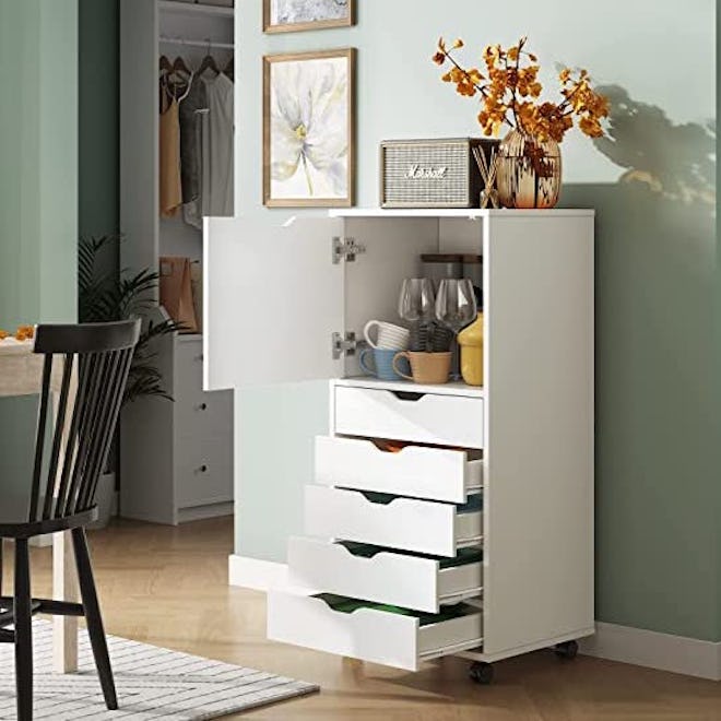 This dresser for small spaces has five drawers and a cabinet.