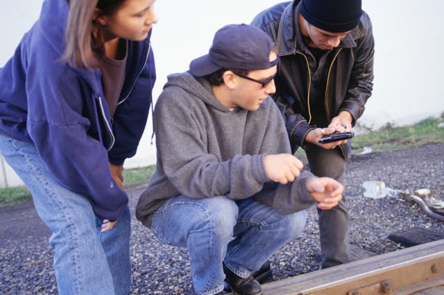 Three teens look at a gun near a railroad track. The CDC just released a new study showing how often...