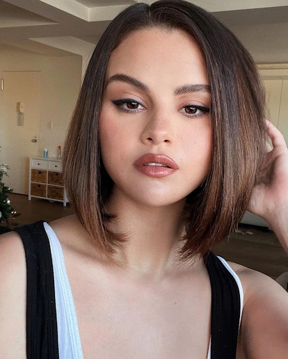 Selena Gomez rocks a fall 2022 hair color trend: French girl brunette, paired with subtle highlights...