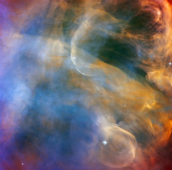 Color image of multicolored clouds of gas and dust in space