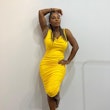 Serena Williams wears a yellow S by Serena dress.